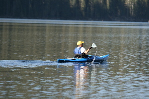 A morning Kayak'er cruising the lake