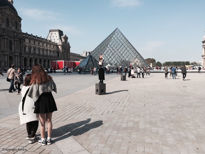 You've seen that before, entrance to the Louvre with a nice long queue on the other side. Word has it that if you don't want to walk through the glass triangle there is a &quot;backdoor&quot; entrance a few steps away.