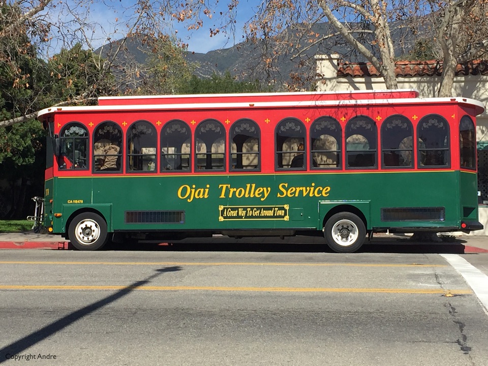Trolley across the street from the coffee shop.