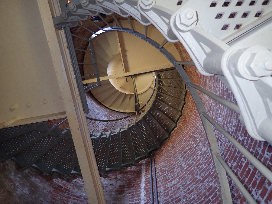 Original circular stairway up to the light.